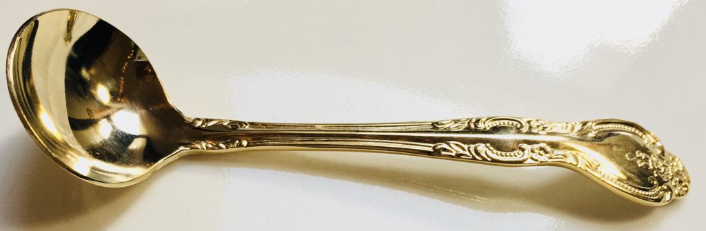 Gold designed sugar ladle